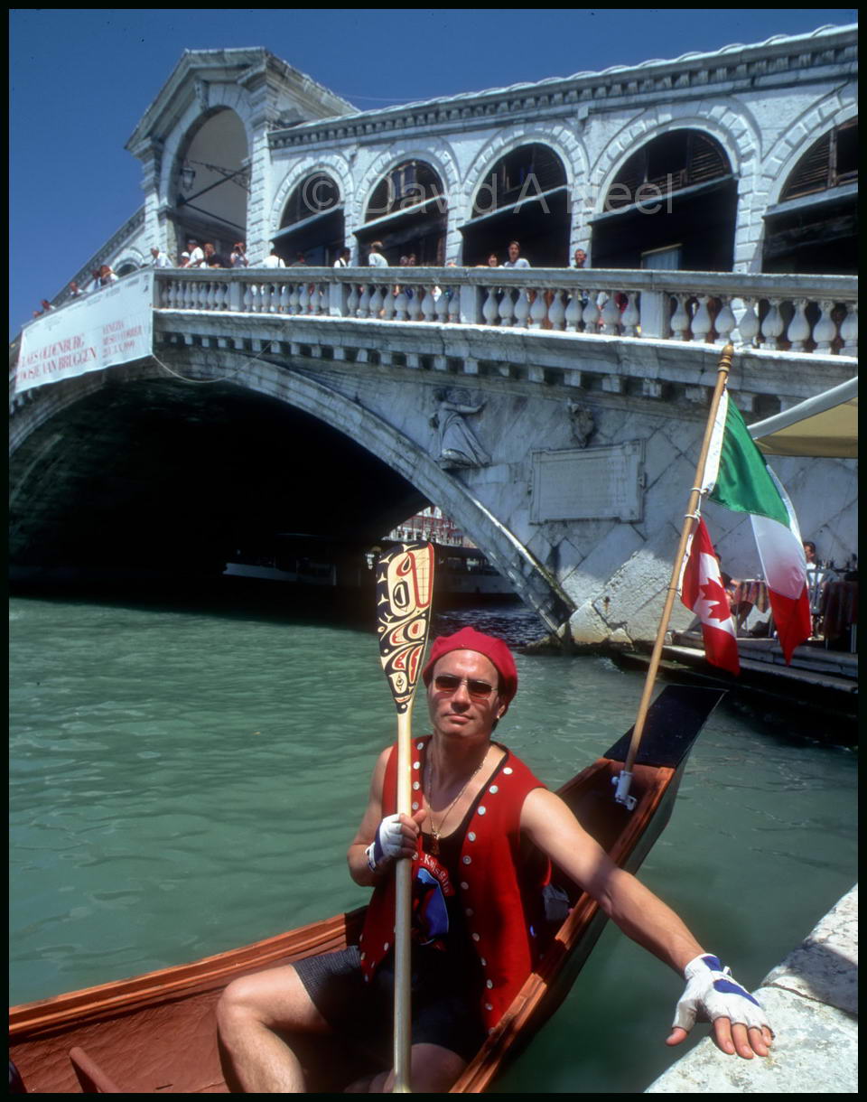 David taking a break from paddling his traditional cedar canoe on the Grand Canal, Venice.